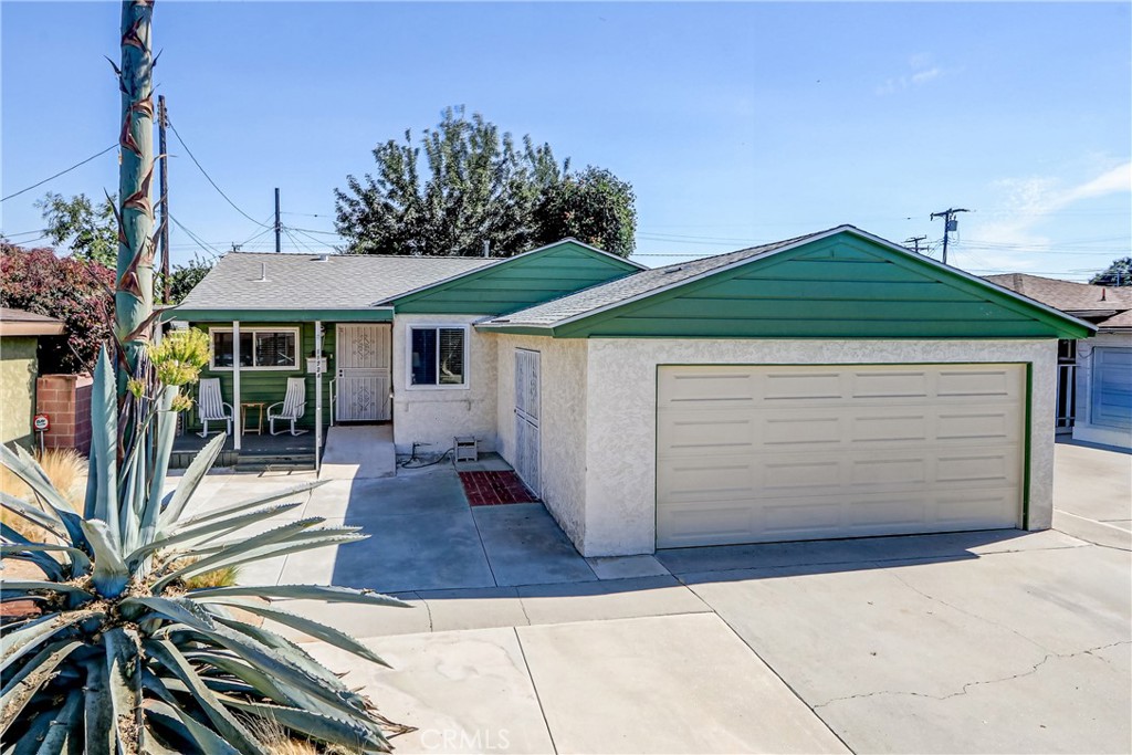 1st time on the market in 69 years! This beautifully maintained, move-in ready, 3-bedroom, 1-bath home offers approximately 1,100 SF of comfortable living space and a long list of thoughtful upgrades inside and out. Energy efficiency is built in with premium Anlin dual-pane windows, 24,000 BTU Mitsubishi mini-split A/C unit, ceiling fans, an owned 12-panel solar system with Tesla Powerwall (2019), an upgraded 240 amp electrical panel, and a newer Owens Corning premium roof (2018) with a transferable 50-year warranty. A new electric garage door was added in 2023 for added convenience.
Step inside to a warm, inviting interior where original hardwood floors have been repolished and restained to showcase their natural beauty. The remodeled bathroom features granite counters and designer tile, while the rustic farmhouse kitchen brings charm and function with butcher block countertops, open shelving, farmhouse sink, and a reverse osmosis water filtration system. A proper laundry room with washer & dryer included is located right off of the kitchen.
The large, private backyard is a true retreat with a huge covered back patio area with a relaxing hot tub, lush landscaping, multiple areas for entertaining, and even a touch of tropical flair. It has plenty of room for the possible addition of a future pool or ADU (verify with city). The drought-tolerant front yard adds curb appeal while keeping maintenance low. Located near local parks and schools, this home combines sustainability, comfort, and style in a prime Norwalk location—ready for its next chapter.