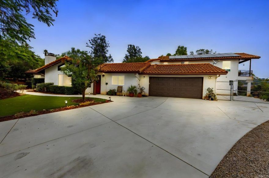 Seller will consider offers between $1,199,000 – $1,250,000 or higher. This 3,403 sq.ft. 4 bedroom, 3.5 bathroom plus den home is more than a residence—it’s a canvas for multi-generational living. With some vision and creativity, you can customize it into the ultimate setup for extended family or private guest quarters. Options include a 2 bed / 1.5 bath two-story rear home with a 3 bed / 2 bath front home, or a studio apartment paired with a 4 bed / 2.5 bath main residence—ideal for a casita, accessory dwelling unit (ADU), guest house or apartment.  Set on a generous lot with sweeping valley views, this property combines thoughtful updates with lasting comfort. Originally built in 1985 and expanded in 2004, it features newer interior paint, a remodeled fireplace, LED lighting, dual-pane windows in select areas, and a refreshed main bath. Modern conveniences include updated kitchen appliances, a tankless water heater and an owned solar system for reduced utility costs. The oversized finished garage is insulated with a newer insulated door and opener—perfect for storage, projects, or recreation. Outside, enjoy low-maintenance living with artificial turf, mature landscaping, dramatic boulders, RV/Boat parking, and a professional drainage system with three irrigation zones. With rare flexibility, owned solar, and a spectacular outdoor setting, this property is more than a home—it’s a lifestyle. Whether you envision a casita, apartment, or ADU, the possibilities are endless for creating the multi-generational living arrangement that fits your future.