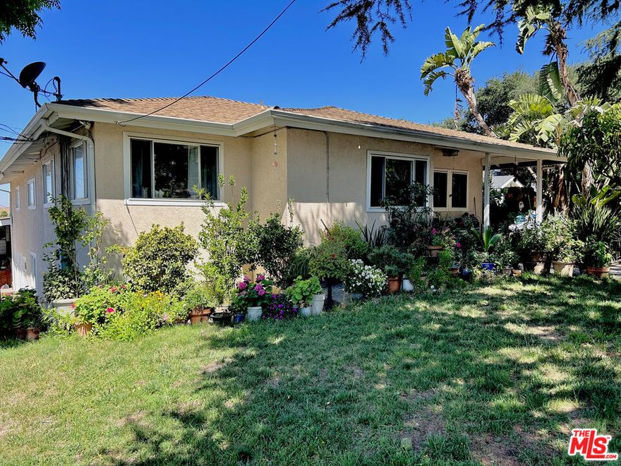 Tucked away in the peaceful hills of Tujunga, this beautifully updated 3-bedroom, 2-bathroom home: a rare opportunity to own a private slice of Southern California paradise. From the moment you arrive, you're greeted by a sense of calm and seclusion, enhanced by the quiet location, mature landscaping, and mountain views that frame the property like a painting. Whether you're a growing family, a remote-working professional, or a couple seeking a place to both entertain and recharge, this home offers a balance of warmth, functionality, and lifestyle. You will immediately feel at home in the inviting living room, where a classic fireplace and original floors blend seamlessly with the rest of the home. Natural light pours in through oversized windows, creating a cozy-yet-open atmosphere that flows effortlessly into the heart of the home. The kitchen is perfect for catering to groups of all sizes, and has ample storage, perfect for everyday cooking or hosting memorable gatherings. All three bedrooms are thoughtfully positioned to provide privacy and comfort. The primary suite is a true sanctuary, featuring vaulted ceilings, a spacious en-suite bathroom with direct access to the stunning backyard retreat. Imagine stepping out of your bedroom each morning for a peaceful swim or soaking in the spa under the stars at night. This is California living at its best. Downstairs, a versatile basement area provides over 400 square feet of flexible space, ideal for a home office, guest suite, gym, media room, or creative studio. There's also a third full bathroom and laundry area, making this lower level a completely functional extension of the main living space.But the crown jewel of this property is the resort-style backyard. Designed for both relaxation and celebration, it features a sparkling heated pool and spa with waterfall, multiple seating and lounge areas, and beautiful hardscaping that invites alfresco dining and outdoor fun year-round. Whether you're hosting weekend BBQs, pool parties, or simply enjoying a quiet sunset with a glass of wine, this space delivers the lifestyle most people only dream about. Additional features include a two-car garage with high ceilings (can be converted to a large ADU), gated driveway parking, updated central HVAC, and a fully fenced yard offering privacy and security.