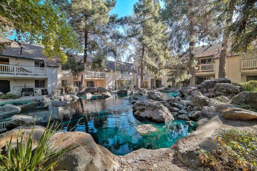 Move-in ready ground-floor 1BD/1BA condo in a quiet gated San Jose community! New Carpet !  This Unit has its own full size Washer & Dryer     Complex has a Tennis Courts   Swimming Pool     Enjoy serene pond views, a cozy fireplace in the living area, an updated kitchen with stainless steel appliances and generous counter space, plus a private patio for outdoor relaxation. New carpet in the bedroom, and modern wood laminate flooring throughout the Unit. HOA covers water, garbage, roof, exterior maintenance, cable TV with DVR, and access to scenic walking paths. Located minutes from Highways 101, 880, and 87, as well as nearby shopping and dining the perfect blend of comfort and convenience.   This is one of the Best Units inside this Gated Community, since unit is located in the Back of the Complex Ground Floor. Peaceful Redwoods and Ponds throughout the Complex.  Units provides You one (1) Covered Parking space, and none-covered parking space and one (1) Guest Parking Space.   Ponds and Ducks found in several parts of the Complex.  On 06/07/25 I saw a group of ducks with their baby ducks!.    CALL LAURA RIVERA TO SHOW OR FOR MORE INFORMATION  408 393 5815  Seller is selling "  AS IS "