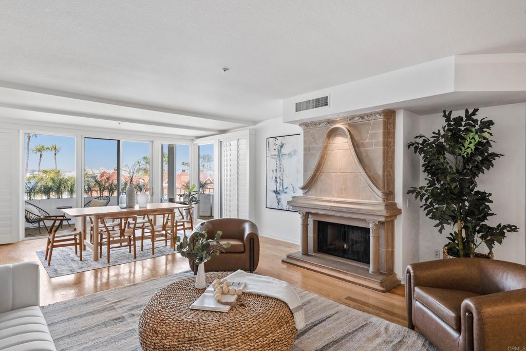 Welcome to your dream Bayfront coastal retreat in one of the most coveted locations in Coronado - The Point at Coronado Village! This expansive 3rd-floor condo at The Point offers unmatched panoramic views of the San Diego Bay, Downtown skyline, Coronado Bridge, and Ferry Landing —all from the comfort of your home. The Point offers one of the most accessible communities on the Island, within one of Coronado's most secure and well managed associations. Spanning 2,368 sq. ft. of single-level living, this 3-bedroom, 3 bath home features a spacious, open floor plan designed to maximize natural light and take full advantage of the surrounding scenery. The beautifully updated interior includes hardwood floors, new paint throughout, new carpet in the primary bedroom and more. The chef’s kitchen offers high-end appliances including a ‘Viking’ range, granite countertops, custom cabinets and wet bar. Floor-to-ceiling sliding glass doors extend the living space onto a private wraparound balcony—perfect for entertaining or simply soaking in the views. The luxurious primary suite features direct balcony access, a spa-like en-suite bath with an adaptive soaking tub, dual vanities, and generous walk-in closet. Two additional large bedrooms, two full bathrooms and laundry room complete the remaining interior. Community amenities include two secure, underground parking spaces, private storage unit, Bayfront pool & spa, fitness center with sauna, and clubhouse. Enjoy the best of Coronado living with easy walkable access to the vibrant Coronado Ferry Landing with an abundance of shops, restaurants, and cafes. Adjacent to Centennial Park and the shops, restaurants and groceries along Orange Avenue. Opportunities like this rarely come along!