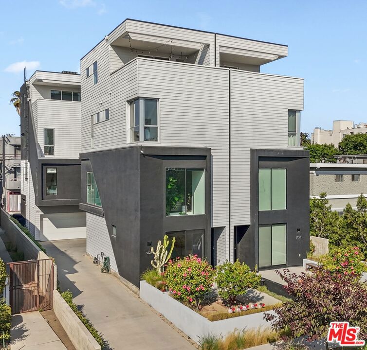 This gorgeous residence has no shared walls- its actually a sfr! Constructed with care in 2018, enjoy ample space, custom blinds, flowing sunshine, skylight heaven and designer finishes. White oak floors, black slate millwork, built in appliances, and sleek and simple tile choices all compliment each other in a unique space adorned with mountain and city views you cannot escape. Check out the drone video with all of the area highlights. The Palms neighborhood started out as a vacation community and is now one of the most central Los Angeles areas, get to UCLA, LAX, Venice or DTLA in 15 minutes. Shop at Traders Joes or Erewhon, have coffee at the local Marionettes or walk to a movie in Downtown Culver City. Tenant pays for all utilities.