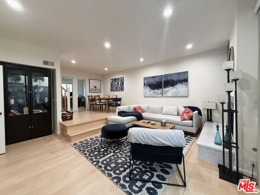 Located in prime West LA, just blocks from downtown Brentwood, this beautifully updated, furnished 3-bedroom, 3-bathroom townhouse offers a bright, open floor plan. The remodeled kitchen features quartz countertops, tile flooring, and modern appliances, flowing into a living and dining area with hardwood floors, recessed lighting, a fireplace, and access to a private patio. Upstairs, the spacious primary suite boasts vaulted ceilings, a walk-in closet, a private balcony, and an en-suite bath. Two additional bedrooms share a skylit full bathroom with built-in storage. In-unit laundry, central air and heat, Ring doorbell, and direct access to a gated garage with two tandem parking spaces and extra storage complete the home. Ideally located near Brentwood's top restaurants, shops, and cafes, with easy access to Santa Monica, UCLA, and major freeways, this is West LA living at its finest.