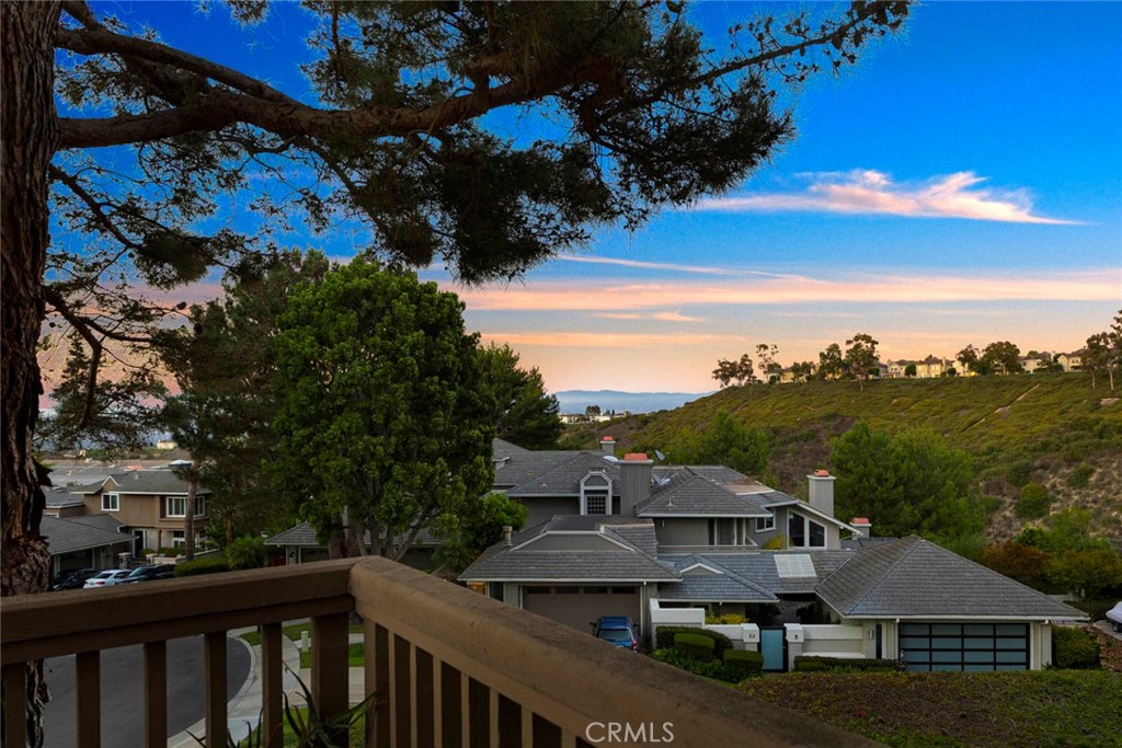 Experience resort-style luxury in this beautifully renovated home, perfectly situated within the prestigious guard-gated community in Newport Beach. Designed with a seamless blend of sophistication and comfort, the residence showcases quality craftsmanship, and thoughtful upgrades throughout.
A luminous entry welcomes you to an open floor plan with soaring ceilings and a skylight. The main level features a guest bedroom with full bath, formal living and dining rooms—both with elegant marble fireplaces—a spacious family room, and a versatile loft. French doors open to a view deck, ideal for indoor-outdoor entertaining. The gourmet kitchen is a chef’s dream with custom cabinetry, a quartz-topped island, breakfast bar, and premium stainless-steel appliances.
Upstairs, the primary suite offers vaulted ceilings, panoramic city-light and treetop views, a cozy sitting area with fireplace, a spa-inspired marble bath with freestanding tub, and a generous walk-in closet. Additional highlights include new wood and marble flooring, custom built-ins, quartz counters in all bathrooms, central air conditioning, and a three-car garage with epoxy flooring and long driveway for added parking.
Residents of Harbor Ridge enjoy four pools and spas, three tennis courts, 24-hour gate-guard security with patrol. The community is just minutes from world-class shopping and dining, top-rated schools, Pelican Hill Resort and Golf Course, and the most beautiful beaches in Orange County. This extraordinary home embodies the very best of coastal living in Newport Beach.