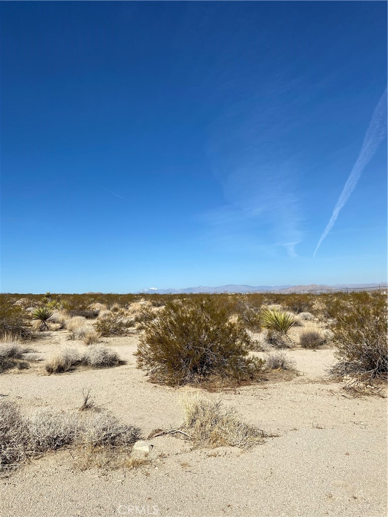 This lot is located just off the Highway 62. Once you turn on Que Pas, the lot is the 2nd one on the right hand side. The lot size 1.25 acres, or 54,450 +/- square feet. There are a few houses on this road.