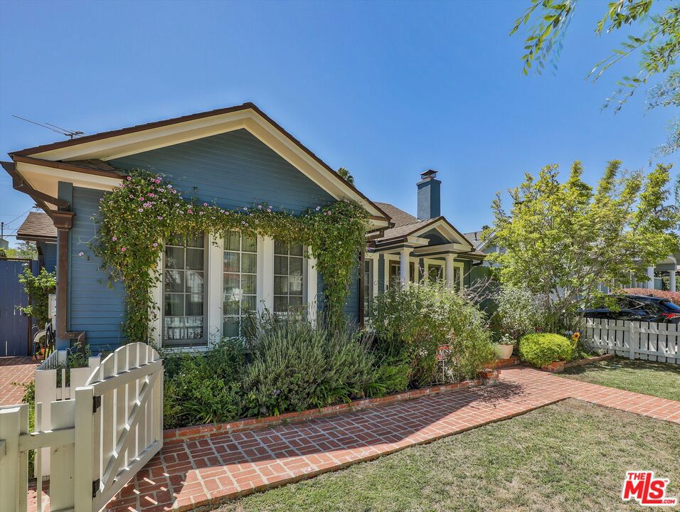 Step into this beautifully remodeled and impeccably maintained 3-bedroom 2-bathroom home (plus 1+1 guest unit), tucked away in one of LA's most desirable neighborhoods. Designed for comfort and elegance, this inviting fully furnished, smart home residence features an open-concept floor plan that seamlessly blends the living room, family room, and a chef's dream kitchen complete with top-of-the-line appliances all flowing effortlessly to a spacious patio and enchanting backyard. The expansive primary suite is a serene retreat, with direct access to the lush backyard and a spa-inspired ensuite bath. Two additional spacious bedrooms share a sleek modern bathroom, while a discreet hallway closet houses a washer and dryer for added convenience. Rich hardwood and designer tile flooring flow throughout the home, adding a warm and sophisticated touch. Outside, your private paradise awaits: a sparkling pool and spa surrounded by mature hedges and fencing for total seclusion and privacy. A detached guest/pool house offers two bonus rooms with their own bathroom and shower perfect for a home office, gym, creative studio, or guestroom, all kept cool with individual mini-split AC units. This smart, solar-powered home is outfitted with fiber high-speed internet, a top-tier security system, a Tesla Powerwall, and dual EV chargers. Utilities and services paid by the Tenant. Tenant must have a minimum 740 Fico Score. The long, gated driveway offers tandem parking for 2-3 vehicles. Located just moments from The Grove, Beverly Center, West Hollywood, and iconic Sunset Boulevard, this turnkey oasis offers the perfect blend of convenience, luxury, and lifestyle.