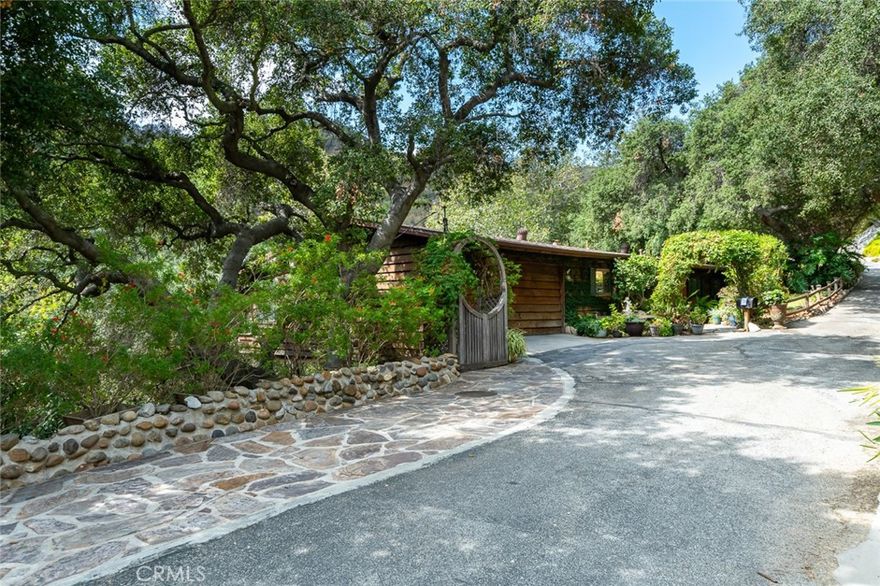 This charming home, nestled in Chevy Chase Canyon, offers a peaceful retreat with an open concept living area that highlights lovely canyon views. The spacious balcony invites you to relax and enjoy the tranquil surroundings, while inside, you'll find two bedrooms, two bathrooms, and a dedicated office for work or study. An arched gateway welcomes you to this unique, non-cookie-cutter home, which stands out for its individual character and serene setting.  If you are seeking privacy and a relaxing retreat this is the home for you.  Also, the lot next door is also for sale for $100,000.  Please reference  MLS #GD25232939 regarding the lot.