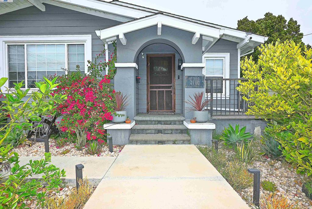 Nestled in one of Oakland's beautiful neighborhoods, this charming 2-Bed, 1-Bath bungalow style home is approximately 848 sq. ft. and is on a wonderful 4,300 sq. ft. lot. Remodeled gourmet kitchen with custom cabinets, state-of-the-art appliances, beautiful countertops and a mobile island. Main bedroom with fireplace and charming 2nd bedroom with ample closet space and brand new carpeting. Back yard boasts a wooden deck that expands your living space made perfect for outdoor dining and relaxing. There is a converted garage that adds flexibility for an office, gym, studio, workshop or extra storage. Blooming flower beds add additional beauty. This home also comes with energy-efficient solar energy (owned, not leased), an EV car charger, automatic drip watering system, A/C, a newer roof and is ready to movie in!! Don't miss this one!