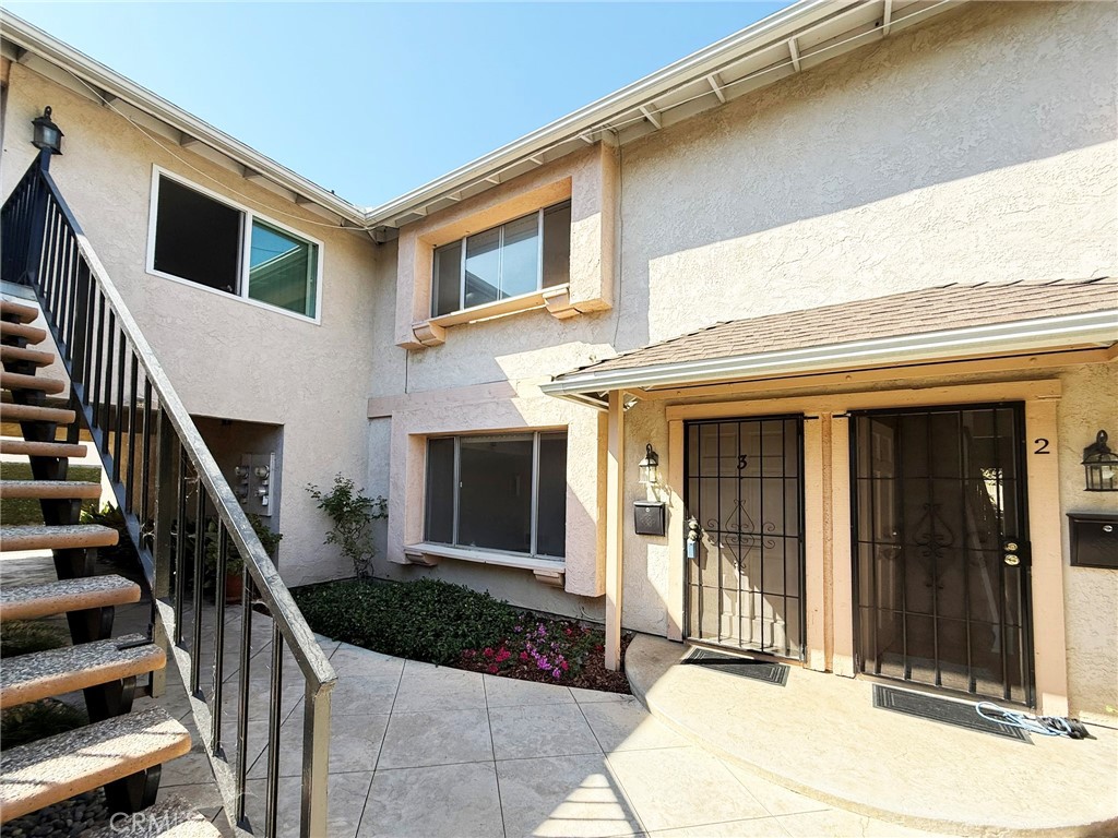 Beautiful Turnkey 2 Bedroom, 1.5 Bath Townhome-Style Unit with 1,000 Square Feet, Located at the End of a Cul-de-Sac in the Heart of Huntington Beach, Close enough to the Beach to Get Cool Ocean Breezes All Year Long. It Features Beautiful Wood Laminate Flooring Throughout, New Dual Pane Windows are going to be installed on 9-26-25. Lots of Windows for Natural Light, Fresh Paint, Ceiling Light Fans, Spacious Bedrooms Each with a Walk-In Closet, Spacious Living Room, a Full-Size Dining Room, a Charming Kitchen with Lots of Counter Space and Cabinetry, Gas Stove, Microwave, and Walk-In Pantry. The Kitchen is Open to the Dining Room with a Slider that Opens to a Lovely Private Patio with Patio Cover, Flower Gardens, and Gate Access to the Single Car Garage where there is a New Washer & Dryer!!! The Tranquil Patio is Quite Spacious and Perfect for Summer BBQ's and Entertaining. There is a Half Bath Downstairs and Full Bath with a Tub/Shower Combo Upstairs, both with Newer Fixtures. There is an Additional Assigned Parking Space. Walking Distance to Shopping and Dining. Close to the Beach, Bella Terra Mall, Pier, Downtown Shops, New Pacific City Shopping Dining & Entertainment. Unit is Immaculate and Ready for Occupancy. Good Credit Please.