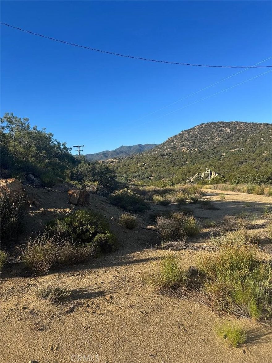 LARGE ACREAGE in Southern California. There is a well that was permitted and drilled in 2001 but the seller will not warranty.
A peaceful, off the beaten path, quiet, secluded area for you to rest, meditate, sit under the stars, 
roast marshmallows and so much more.  This 19+ acres is rolling, flat, and tiered so its topography is interesting and capable of so many things.
This area is dark at night and if you are an astronomer or inspiring to be astronomer you can lay back and see the milky way and enjoy
the constellations.  
We have NO light smog and no real smog, just birds chirping or crickets, squirrels, rabbits, and so many other animals that fill our area. 
Do you want to build a vineyard or fruit orchard or?????  How about goats, sheep, chickens, ducks, horses, etc, The possibilities are endless.
We are not going to lie to you that the road is perfect but once you get here you will know it was well worth the drive.
Come and see