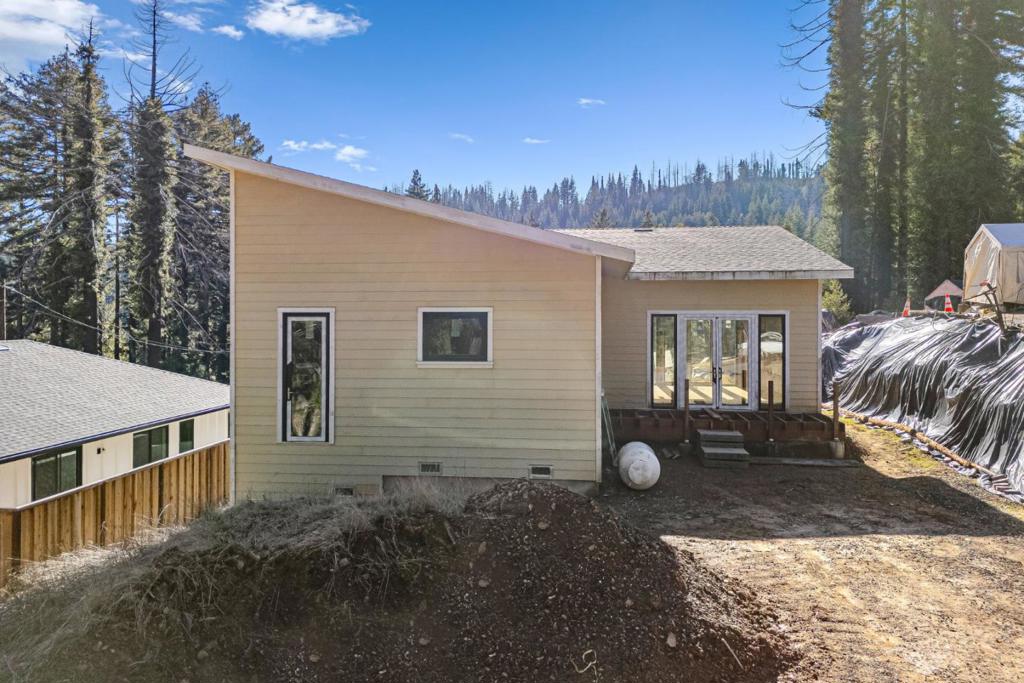 If you have ever been interested in building, here is an opportunity for someone looking to put their personal stamp on a home in a beautiful location! Imagine owning a brand-new home in Boulder Creek, surrounded by nature and nestled in a peaceful, quiet neighborhood with other newly built homes. This is a CZU rebuild, so the hard work has already been done, and now it's up to you to choose your finishes and make the space your own. 2-bedroom 2-bath home, with extra storage under the home the sellers had envisioned it as a wine cellar. This might be a good first-time project to take on. With all the permits and pre-clearance in place, you can jump right into the fun part, designing the interiors to match your taste and style. Whether you prefer modern or rustic finishes, this home is a blank canvas, ready for your vision. And with the lovely setting in Santa Cruz County, you'll be able to enjoy the best of both convenience and tranquility. It's a unique chance to take part in the final stage of building a home and truly make it yours! Permit still active and PG&E application submitted.