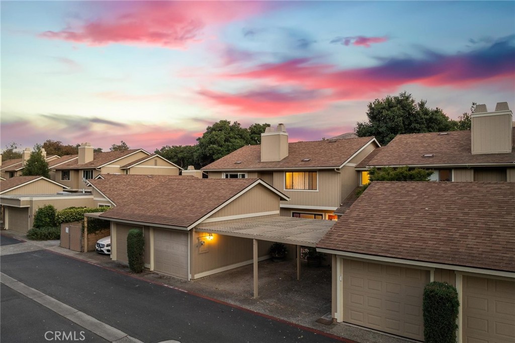 2250 King Court #4 – Your Front-Row Seat to Meadow Park Living
Tucked inside the peaceful Village condominiums, this updated modern condo offers more than just a home—it’s a lifestyle. Park with ease in your carport, dedicated space, or garage, and stroll up to the welcoming flagstone patio that hints at the charm inside.
Step through the front door to find a sun-lit living room with vinyl plank flooring that flows into the dining area. Your updated kitchen opens right to the dining space, creating an easy flow for both daily life and gatherings. Here you’ll enjoy sleek, bright white cabinetry, solid surface counters, modern appliances, and a picture-perfect view of the trees and greenery in Meadow Park.
A cozy fireplace adds warmth to the living area, while a sliding glass door off the dining room leads to your private deck—the perfect spot for morning coffee, evening wine, or simply watching the dogs and neighbors pass by on the park trails. Step through your own gate to access it all: walking paths, volleyball courts, baseball fields, pickleball courts, the playground and fun events, such as art in the park.
Downstairs you will also find a stylish powder room with quartz counters and indoor laundry! Upstairs, two comfortable bedrooms, a balcony perfect for relaxing and enjoying the outdoors, as well as the primary bath with quartz counters, modern lighting and an updated tile shower.
Other updates include custom up down, down up blinds, a new sewer line and water heater too!
Set in the heart of San Luis Obispo, you’re just minutes from world-class dining, wine bars, boutique shopping, and everything the SLO Life offers!