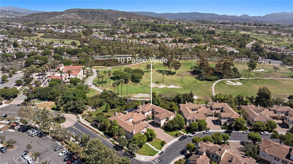 Perfectly positioned on the 9th green of the Talega Golf Course, this beautifully appointed residence blends timeless elegance with thoughtful upgrades throughout. Welcome to this incredible 3 bed 2.5 bath in a the Santalana neighborhood of Talega. From the moment you enter, refined details and custom craftsmanship set this home apart. The interior boasts TriWest-Kahrs wood flooring complemented by Tagina Tivoli Roman Scuro tile across the first floor, while the primary suite is elevated with Crema Marfil marble and a frameless glass shower enclosure. Matching Petra Latina tile carries seamlessly into the bathrooms and laundry. A custom-built California Closets system enhances the primary walk-in closet, while crown molding graces the living room, primary bedroom, and bath for a touch of sophistication. The kitchen has been extensively upgraded, featuring quartz-wrapped counters and backsplash, cherry wood soft-close raised panel cabinetry, and an air purification system integrated with the HVAC for modern comfort. A finished black marble fireplace, custom staircase railings, and upgraded insulation further reflect the home’s quality. Outdoors, enjoy resort-style living with beautifully designed hardscaping and landscaping. A custom BBQ, fountain, and limestone finishes create the perfect setting for gatherings, shaded beneath a freestanding patio cover. The garage is complete with epoxy floors and custom built-in cabinets for a clean and polished finish. This home is a rare opportunity to experience luxury living with serene golf course views and an array of custom upgrades. Come enjoy all that Talega has to offer with an abundance of pools, parks, and easy access to shopping and dining.