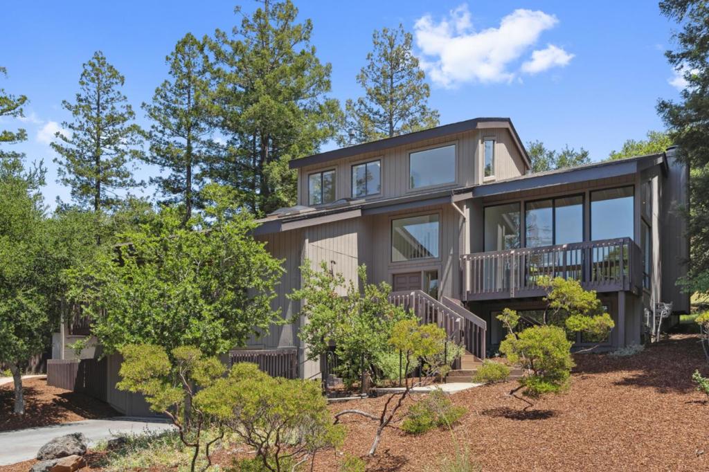 This extraordinary Portola Valley Ranch property combines rare level land, breathtaking Windy Hill views from every floor, and a comprehensive whole-home remodel all on just over one-half acre. The homes thoughtful expansion and renovation, along with just completed interior and exterior painting and completely redone bamboo and hickory floors throughout, present a beautiful ambiance. With large windows enhanced by skylights in almost every room, the house is filled with natural light. Formal living and dining rooms extend to expansive decks at both the front and rear, perfect for fresh air entertaining AND outdoor play hard to find features in the Ranch. At the heart of it all is a beautifully remodeled kitchen appointed with custom cabinetry and high-end appliances.