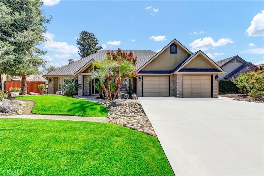 This stunning home in the prestigious Lakes Gated Community blends timeless craftsmanship with modern comfort. Thoughtful architectural details, custom molding, and abundant natural light create an inviting atmosphere, complemented by rich dark flooring and plantation shutters throughout.



As you step inside, you'll find two versatile flex spaces - perfect for a home office, gym, or formal dining. The spacious living room boasts vaulted ceilings and French doors leading to your private backyard retreat. The remodeled kitchen (2014) is designed for both elegance and function, featuring double ovens, a wine fridge, custom cabinetry, and a walk-in pantry.



The west wing hosts three bedrooms, including two generously sized guest rooms with walk-in closets and a luxurious primary suite offering dual vanities, dual closets, a walk-in shower, jet tub, and private toilet area - all with direct views and access to your canal-back yard. The backyard canal connects directly to the main lake, giving you easy access for boating, fishing, and lakefront fun right from home.



Perfect for entertaining, the backyard features a large covered patio, built-in firepit, two grassy areas, lush landscaping, and a concrete pad - ideal for outdoor dining or parking your boat.



The Lakes is Visalia's premier gated neighborhood, offering 24-hour manned security, two pools, two clubhouses, tennis courts, fishing, sailing, and so much more. Schedule your private showing today!