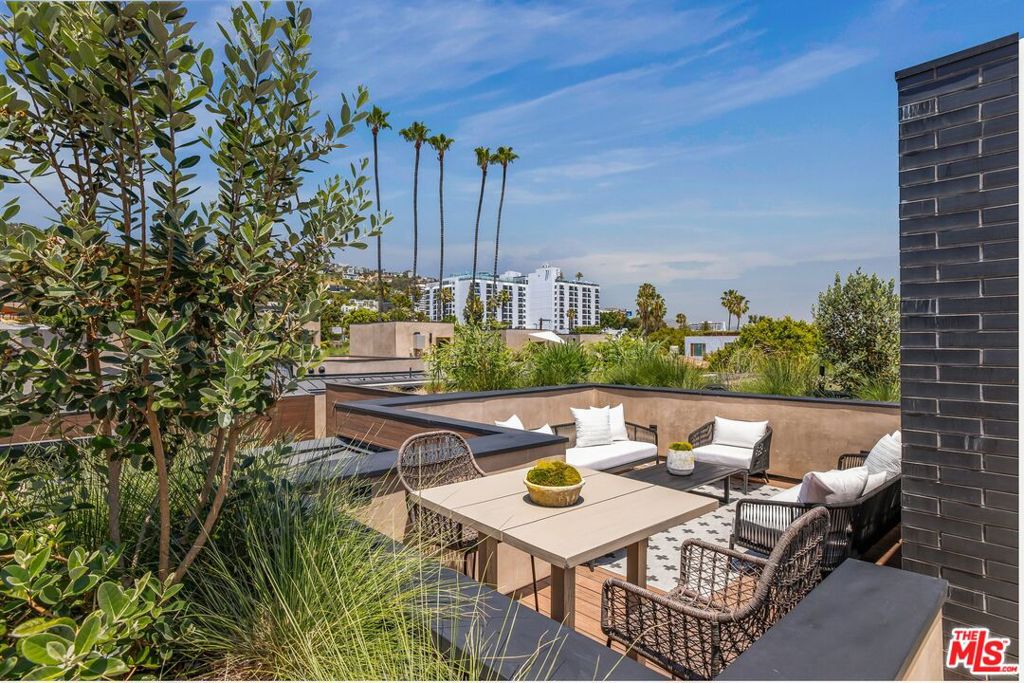 Experience luxurious living in the heart of West Hollywood's prestigious Norma Triangle neighborhood within these stunning contemporary residences. 919 1/2 Hilldale is sited on one of the largest lots in the community and features expansive outdoor entertaining areas. Designed by renowned ANR Signature, these single family new builds offer a modern take on urban living, complete with private rooftop decks boasting breathtaking views of the city skyline and downtown. With two distinct design palettes inspired by artists Brice Marden and Robert Ryman, these two to three bedroom homes are truly masterpieces of modern living. Inside these gated residences, discover meticulously designed interiors with high ceilings and premium finishes throughout. Southern homes offer expansive living areas with soaring ceilings, mezzanine levels, and loft spaces. Kitchens are equipped with top-of-the-line Miele appliances, complemented by European Oak cabinetry and honed concrete or oak flooring. Primary bathrooms feature spa-like wet room designs with clerestory windows. Smart home technology ready adds ease.The spacious primary suites boast finished walk-in closets and luxurious bathrooms with high ceilings and ample natural light. The guest bedroom is thoughtfully designed, with bonus spaces ideal for creative pursuits. Enjoy your own private rooftop deck, perfect for entertaining or enjoying quiet evenings overlooking the city. The home also features a direct access garage with car lift. Situated moments from the Sunset Strip, West Hollywood Park, Pacific Design Center, and the vibrant Melrose shopping district, residents enjoy easy access to the best dining, retail, and entertainment options the area has to offer. West Hollywood Elementary School is also nearby.