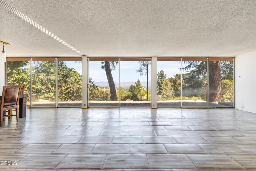 Welcome to Dorilee, a private cul-de-sac in Encino just minutes from the West Side. This private, single-story, mid-century modern sits above the neighbors properties with unobstructed 270 degree views of the Valley. There is a long private driveway and parking for 3 or more cars, including a large 2 car garage. The home features large open spaces, large glass doors and windows, 5 large bedrooms and an entertainers kitchen. The backyard is a nature lovers dream with a large hillside and private space to enjoy the outdoors. Schedule a showing today and make this Encino Oasis your reality!