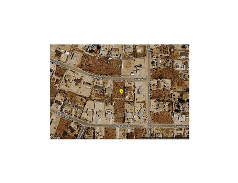 Photo of 0 Caliente, Yucca Valley, CA 92284 (MLS # SR26120644)