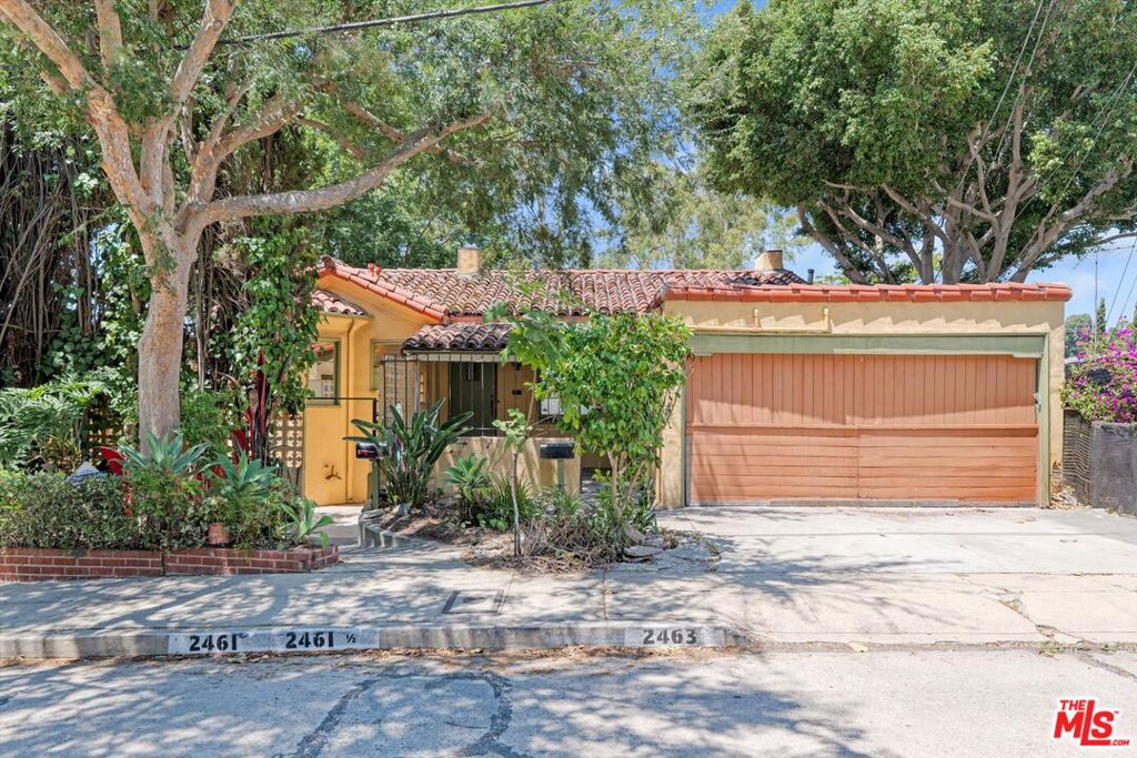 Discover the timeless charm of this original Spanish triplex nestled high in the trendy Silver Lake neighborhood at 2461 McCready Avenue, Los Angeles. This unique fixer-upper spans 2,828 square feet, offering a wealth of potential within its walls. Each of the three units boasts its own floor, providing privacy and breathtaking views across Los Angeles.The top and middle units each feature two bedrooms and one bathroom, perfect for creative living arrangements, while the bottom unit consists of one bedroom and one bathroom. Residents will enjoy the expansive shared backyard, an ideal setting for gatherings or personal relaxation. While the property is in need of repairs and updates, it presents a fantastic opportunity for those with a vision to restore and rejuvenate its original beauty. With a total lot size of 4,430 square feet, this triplex stands as a blank canvas for your creative ideas and development plans. Embrace the vibrant Silver Lake lifestyle and make this distinctive property your own.