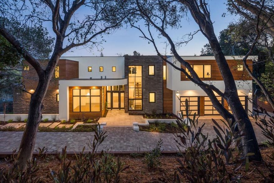 This newly built sleek modern is situated in a central Hillsborough location and provides all the luxurious amenities to live your best life. Floor to ceiling custom Pella windows and glass doors flood the home with an abundance of natural light and views of the vistas. The functional gourmet kitchen includes Thermador appliances, white quartz countertops and a large eat-in island.  On the upper level, windows line the halls to all three en-suite bedrooms including the master bedroom with a luxurious soaking tub, a gas fireplace and private patio. On the lower level is another bedroom suite, 2nd family room and wine cellar that opens up to one of the multiple patios perfect for indoor/outdoor entertainment and enjoyment.