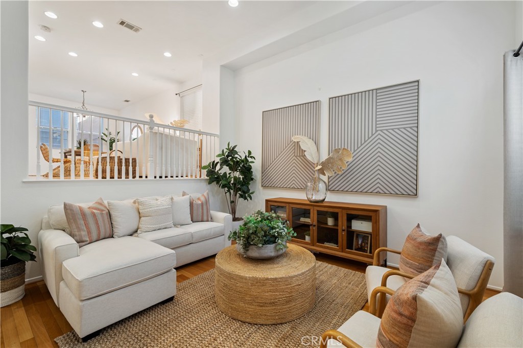 This detached Harbor City townhome is a true standout, with abundant natural light, modern upgrades, and a split-level design that feels both spacious and inviting. The light-filled 3-bedroom, 2.5-bath home offers soaring ceilings and tall windows that flood the living spaces with natural light. Hardwood floors flow through the main living areas, while the open kitchen with a center island and stainless steel appliances, including a built-in microwave, dishwasher, and stove, connects seamlessly to the dining room and a seating area, creating an ideal space for entertaining.
Upstairs, all three bedrooms are finished with carpeting. The remodeled primary suite boasts a hotel-like bath with a tiled shower, marble vanity with an LED mirror, and a custom walk-in closet with built-in drawers and shelves. Guest bathrooms include a full bath with a quartz vanity and LED mirror, while a powder room serves the main level.
A private patio offers the perfect spot for outdoor dining and BBQs, while a secured front courtyard enhances the sense of privacy. Additional highlights include central AC and heat, a washer and dryer in the garage, and a two-car garage with direct access. Enjoy low HOA and secured access, as well! This home offers all the modern amenities you need with easy access to freeways, Kaiser’s hospital, Palos Verdes, and the beach cities and moment’s from Ken Malloy Park, putting the best of the South Bay right at your doorstep.