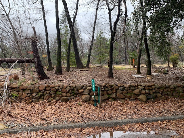 Looking for a great level lot in lower Magalia? This may be the one for you. Great subdivision with CC&R's in effect. House must be stick built and1700 square feet or more. This property is nearly 3/4 acre and has a concrete driveway in place as well as some beautiful hardscape with mossy lava rock. The previous home was over 1900 square feet giving some great building credits. Some see this great property.