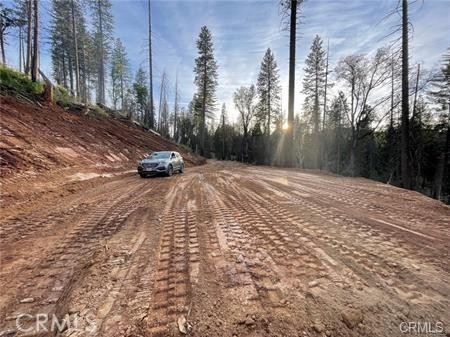 Discover the ultimate in California living with this stunning 2.29-acre forested oasis that borders the Sierra National Forest. Boasting unparalleled access to nature, this slice of paradise offers a rare opportunity to live surrounded by breathtaking scenery and endless recreational opportunities. With close to $20,000 of recent excavation work, including a freshly graded road and building pad, this parcel is primed and ready for your dream home or vacation retreat. No CCR's or HOA! Step outside your front door and immerse yourself in the great outdoors with hiking, horseback riding, ATV adventures, and world-class hunting opportunities right at your fingertips. Take a leisurely hike to the top of the mountain and marvel at the breathtaking vistas that stretch for miles and miles. The possibilities are truly endless, and the only limit is your imagination. Whether you're seeking a peaceful escape from the hustle and bustle of city life, a place to build lifelong memories with family and friends, or a chance to immerse yourself in nature like never before, this exceptional property has it all. Don't miss out on this once-in-a-lifetime opportunity to make your dreams a reality. Schedule a visit today and start living your best life surrounded by the beauty and wonder of the Sierra National Forest.