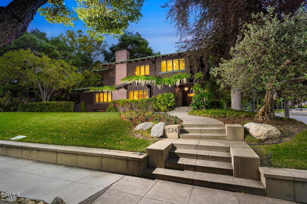 G. Lawrence Stimson, was one of the most successful architects and builders in Pasadena. This Breathtaking early 1900's Craftsman Estate, is one of Stimson's masterpieces. There is an abundance of elegance and it is nestled on one of South Pasadena's most prestigious, tree-lined streets. This residence exudes timeless sophistication, offering a seamless blend of classic charm and modern convenience. As you approach, a beautifully landscaped front yard guides you to the inviting covered front porch. Upon entering, the formal entryway introduces you to an expansive living room, adorned with a box beamed ceiling, an exquisite fireplace, and custom built-ins. French doors open to the tranquil backyard, creating a perfect flow for entertaining. The large formal dining room features elegant wainscoting and direct access to a covered back patio, ideal for al fresco dining. The spacious kitchen boasts built-in appliances, a pantry, and a cozy eating area, complemented by convenient access to the laundry room. The basement level includes a separate family room with stunning wall of custom built-ins and an abundance of storage space. Upstairs, discover all four bedrooms, including a dreamlike master suite. This sanctuary offers dual closets, dual vanities, and a dedicated office space, providing a serene retreat. The backyard is a haven of leisure with its playful lawn, gazebo, multiple patios, mature avocado tree, and gated access to a detached 2-car garage with guest quarters featuring a kitchen, built-in murphy bed, washer/dryer and 3/4 bath. This estate is more than a home; it's a lifestyle--a testament to refined living in the heart of South Pasadena. Close to Eddie Park, Garfield Park, Restaurants, shops and South Pasadena's award-winning Blue Ribbon Schools.