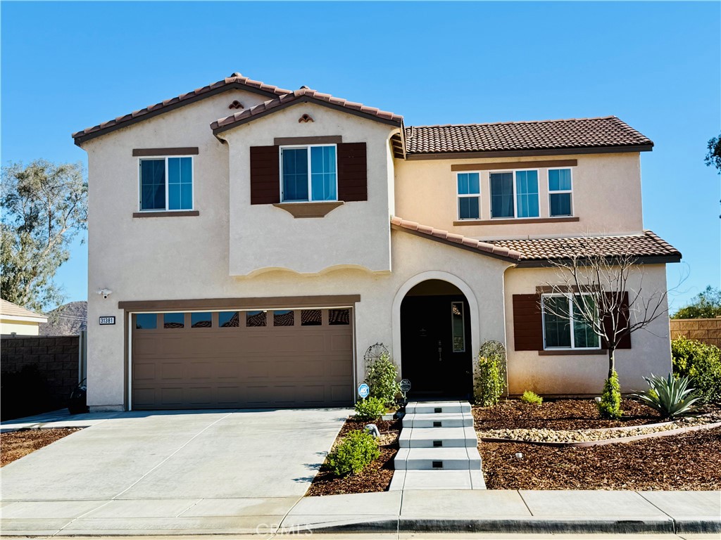 Life moves fast, and so does the opportunity to own a home this special. This amazing property has a floor plan that's ideal for a multigenerational family, housemates, or anyone who simply wants plenty of space.You get to enjoy a new neighborhood without the mess and noise of ongoing construction. The community amenities are already finished and ready for you, including a playground, a basketball court, and a pavilion for celebrations, all just a short walk away.This large, level lot gives you the freedom to design the backyard of your dreams. Imagine a sparkling pool, a peaceful private sanctuary, or RV parking—the possibilities are endless. The front yard is already beautifully landscaped with drought-tolerant plants and a lighted walkway for a welcoming, low-maintenance curb appeal.Security is already taken care of with a Ring doorbell and several outdoor cameras included, providing views of the front porch, driveway, and backyard. An additional interior camera is also installed, offering a comprehensive security system that stays with the home.
Step inside and discover an amazing interior with a smart layout. The lower level features a separate secondary bedroom and full bathroom at the front of the house, offering privacy for guests or family. The laminate flooring in the main living areas is durable, easy to clean, and provides a fresh, modern look.The heart of the home is the open-concept great room, with high ceilings, recessed lighting, and lots of windows that fill the space with natural light. The kitchen is a chef's delight, with a large granite island for seating, stainless steel appliances, and tons of storage. The outlets even have convenient night lights built-in. A downstairs laundry room makes multitasking a breeze. A storm door with screen option on the garage entry allows for cross-ventilation.
The primary suite is also on the first level and features a luxurious oversized shower with dual showerheads, a beautiful vanity, and a spacious walk-in closet. Upstairs, a spacious area awaits. What will you do with this versatile space? A home office, a playroom, or a movie theater? Down the hall, you'll find three more generously sized bedrooms and a full bathroom.
Adding to the value, the 12 solar panels are owned, which will help keep your energy bills low land an EV charger is installed.This home is located close to schools and is in one of the few developments with NO HOA fees. Don't miss out on this incredible opportunity!