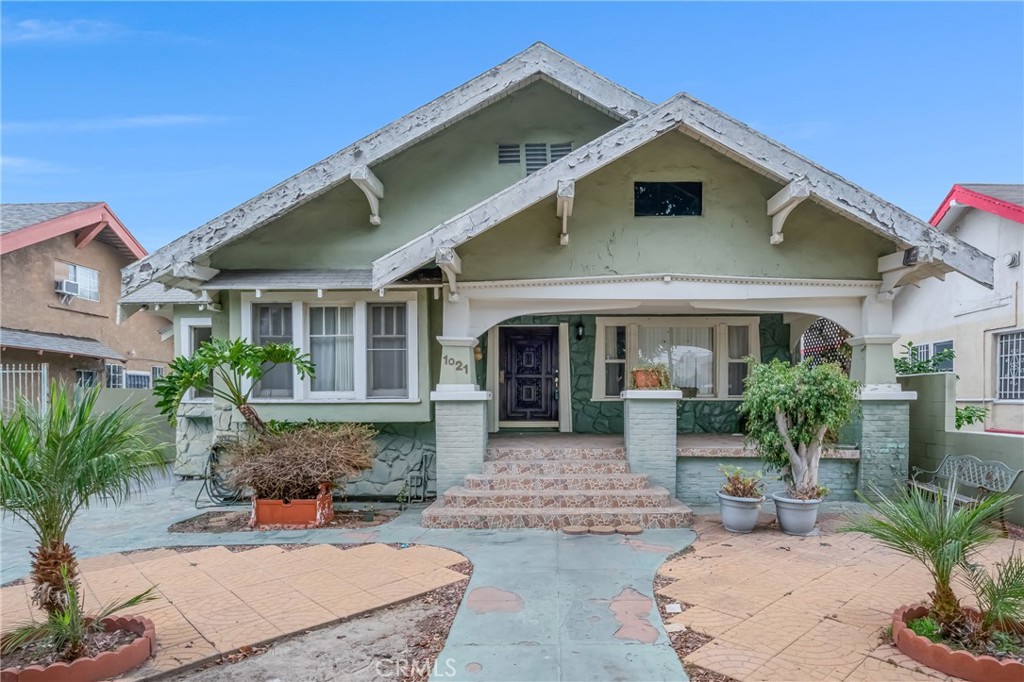 Investor opportunity in the heart of Vermont Square! This Craftsman-style home offers 7 bedrooms and 2 bathrooms across 2,096 sq. ft. of living space, situated on a 6,470 sq. ft. lot. The property is legally a duplex that was converted into a single-family residence at an unknown time, creating a spacious floor plan with one bedroom upstairs and the rest on the main level. The home includes a driveway and garage, plus an additional parcel directly behind the property (APN: 5017-029-043, 1,000 sq. ft.) which is included in the sale. The property needs cosmetic upgrades, a potential floor plan reconfiguration, and possibly a new roof, making it an ideal project for investors seeking value-add potential. Zoned LAR1 and delivered vacant, this home is ready for its next chapter. Conveniently located near USC, Exposition Park, and major freeways, this is a prime opportunity in an up-and-coming neighborhood.