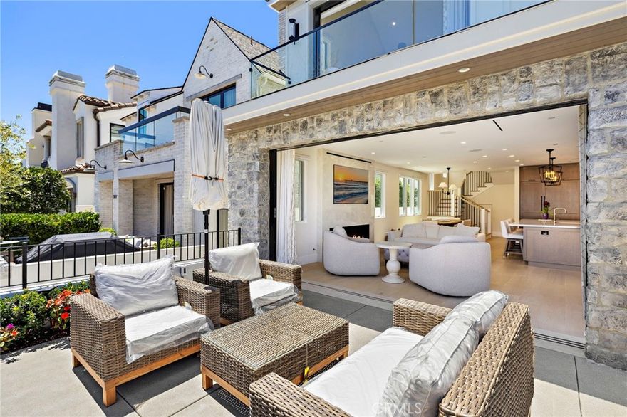 EXQUISITE HOME AVAILABLE FOR SALE, OR SHORT-TERM LEASE (3–6 MONTHS), FULLY FURNISHED AND MOVE-IN READY.  Magnificent new construction home, highly upgraded and landscaped, available on perhaps the most beautiful of all Flower streets and in the best location. Walk to countless restaurants, the beach, grocery stores, beauty salons, banks, design and hardware stores and enjoy scenic walkways. For travel convenience, John Wayne Airport is just up MacArthur. Located south of Pacific Coast Highway, one often hears sea lions late at night but no sound from Pacific Coast Highway. Additionally, every surrounding home is stunning. Begonia Park - just over a block away, and Old School Park even closer. From the primary bedroom balcony, there is a peekaboo view of the ocean. From the top deck, there is added quiet, privacy and night sky viewing. Enjoy the front patio as a social point throughout the day and evening or open the enormous LaCantina doors that disappear 100% into the wall both upstairs and down for a completely open feel to the home. There is a downstairs bedroom or office and a private side patio separated from the front. There are numerous upgrades the owner painstakingly added, including but not limited to a top of the line drinking water and instant boiling water system, designer installed hardwired ceiling fans, top down bottom up blinds and interlined LaLique Designer made custom drapery; two separate Central Vacuum systems - a rarity in homes and a quiet convenience - one for the garage & car and one for inside; Mount Blanc quartzite counters, island and full backsplash; Italian porcelain laundry room and floor to ceiling on the wall to the fireplace and custom installed Samsung 77” Frame television; wrought iron exterior wall and entry gate; undercabinet dimmable lighting, custom all designer lighting; entire house inside and out on dimmers. In addition, there are three thermostat zones throughout the house for individualized heating and cooling; a tankless water system; electric vehicle built in charging station; rooftop solar; 36” wide built in Sub Zero refrigerator plus freezer; commercial Wolf stove & oven. One car direct access garage, and a carport.
