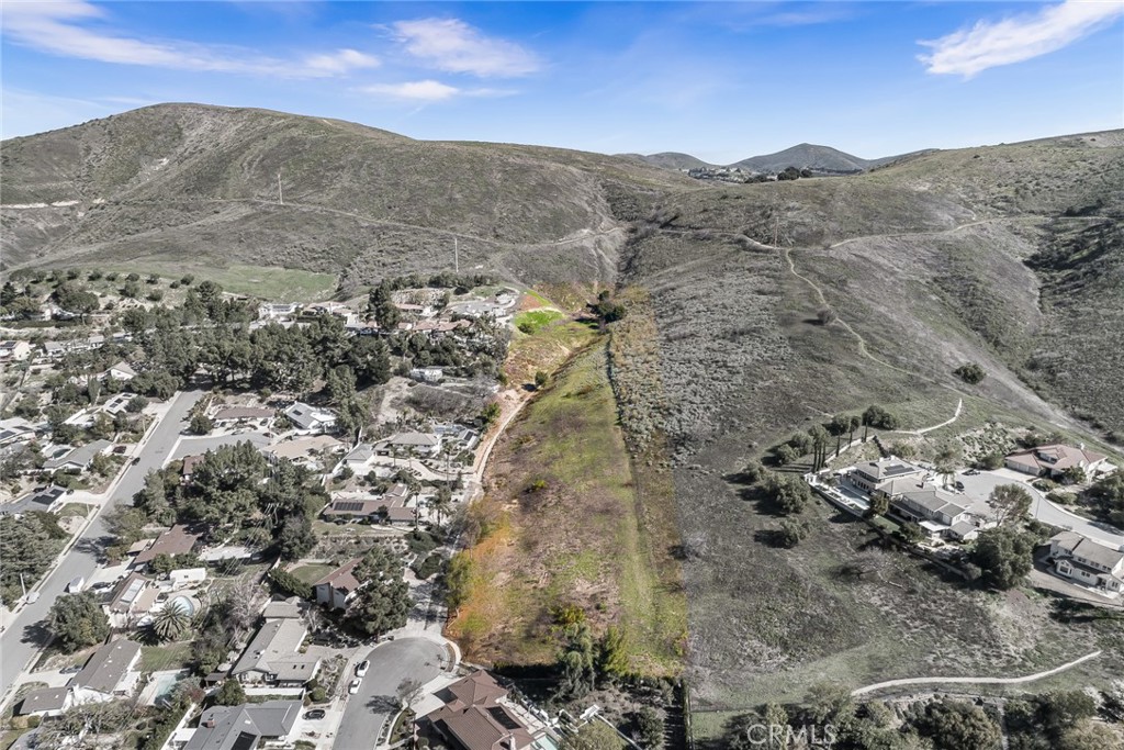 Discover the rare opportunity to own a premium parcel of vacant land in one of Thousand Oaks’ most sought-after neighborhoods—Conejo Oaks. Tucked away at the tranquil end of a prestigious cul-de-sac, this remarkable property spans over one acre and offers unmatched privacy, panoramic views, and limitless potential. For those with a grander vision, an adjacent parcel is also available for sale, allowing for a combined total of nearly 4 acres—an extraordinary offering in this coveted community. Surrounded by luxury custom homes and set against a breathtaking backdrop of majestic mountains, vibrant city lights, and vivid sunsets, the land presents an unparalleled canvas for development. Whether you're looking to build an exclusive gated estate, a bespoke multi-generational compound, or a series of refined custom homes, this property offers the flexibility and scale to bring your dream project to life. Located in the heart of Conejo Oaks, this property is just moments from top-rated schools, premier shopping centers, gourmet dining, and a network of scenic hiking and equestrian trails. All essential utilities are conveniently located at the street, simplifying the development process. This is more than just land—it's a gateway to creating something truly special in one of Southern California’s most desirable neighborhoods. Don’t miss this unique opportunity to shape a legacy in Thousand Oaks. Geotech, environmental and biological reports are available.