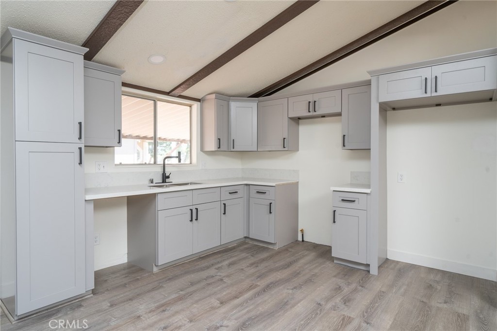 Discover tranquil living in Victorville’s premier 55+ community, Seasons, presenting a charming manufactured home ideal for enjoying the golden years in style. Freshly listed on the market, this residence skillfully combines comfort and elegance, featuring three generous bedrooms and two well-appointed bathrooms.
Enter through a front entrance equipped with an electric elevator/lift, leading into a welcoming open-concept living area. Recently refreshed with new flooring and a coat of paint, this home provides a pristine, low-maintenance environment, allowing you to easily imprint your personal style. The thoughtful layout encourages easy living and effortless entertaining.
Experience the peace of this carefully designed community meant for active adults like yourself. Take leisurely walks along tree-lined paths or find a cool spot under a shady tree within the beautifully manicured grounds. For a refreshing dip, the community swimming pool awaits, or you can visit the clubhouse to join in social activities that foster community ties and lasting friendships.
Whether hosting family gatherings or enjoying a peaceful afternoon solitude, this home adapts to your lifestyle needs. It’s more than just a residence—it’s a gateway to a fulfilling lifestyle, crafted just for you. Embrace the chance to live and love your life here, in a home that promises both relaxation and engagement.