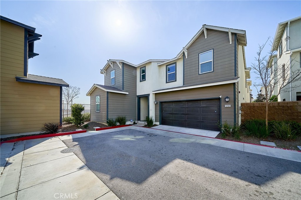Beautiful gated community of The Villas at Harbor Pointe. 2-story single home free-standing in Harbor City! Perfect end unit. The fully detached townhouse truly has it all. As you enter, you’re welcomed to an open-concept floor plan. The first level includes a living room, dining area, kitchen, full bathroom, and bedroom. The kitchen boasts dark brown shaker cabinets with beautiful quartz countertops, stainless steel appliances, a walk-in pantry, and a large island with counter seating. Enjoy direct access to the 2-car garage from the kitchen, making it easy to unload groceries. The home has central AC and heat for added convenience. The outdoor private back patio is accessible through the dining area. Upstairs, you’ll find a BONUS FAMILY ROOM for fitness/media/office, three bedrooms, a bathroom, and a large laundry room. The primary suite features a spacious walk-in closet and bathroom with a double sink vanity, deep soaking tub, and walk-in shower. It’s also one of the few end units in a cul-de-sac. The community features a grassy park, children’s playground, dog park, and picnic areas with BBQs. It’s just east of Torrance, easily accessible to freeways, and close to hospitals. The solar panels on the roof.