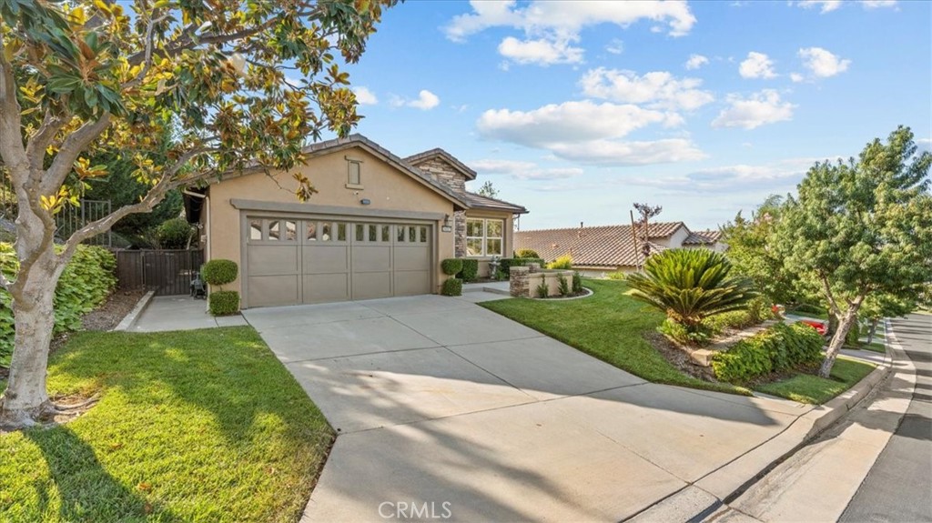 Absolutely gorgeous single-story home located in the highly sought-after 55+ Active Adult Community of Trilogy Glen Ivy, a gated masterplan community in Corona, directly next to the award-winning Glen Ivy Golf Club with its own private, golf cart back gate access unique to the Saddleback Canyon neighborhood. This charming 2-bedroom, 2-bathroom home offers comfort & quiet living in a peaceful & private neighborhood with resort-style amenities. Its spacious floor plan invites plenty of natural light throughout, creating a welcoming atmosphere, while the primary suite includes a private ensuite bathroom & walk-in closet. The secondary bedroom connects to a convenient Jack-and-Jill bath, also ideal for guests. Its 2-car garage offers ample built-in storage, while the interior is enhanced with updated wood flooring & carpet throughout. Washer & dryer are also included, located conveniently in a separate room. Its front curb appeal boasts a pristinely manicured front yard maintained by the HOA, with a scenic view as well as an upgraded backyard complete with a covered patio & built-in water fountain. Beyond the doorstep, homeowners can enjoy all of the resort-style amenities & activities offered throughout the community, including tennis, pickleball, & bocce ball courts, a state-of-the-art fitness center with an indoor lap pool plus jogging track, as well as outdoor relaxing pools, jacuzzis, cabanas & BBQ grills. For entertainment, enjoy live music & events at the community amphitheater & in the elegant Grand Pacific Crest Lodge Ballroom. With photography & art studios, billiards, card games, & computer rooms, there’s always something to do. The community also offers breathtaking mountain & canyon views & is just minutes away from Glen Ivy Hot Springs & Tom's Farm, well-known for its charming, family-friendly atmosphere with a variety of attractions including fresh produce, eateries & antique shops. Welcome to 24057 Watercress Drive.