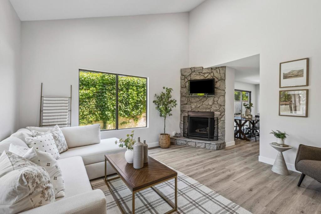 Let me show you this gorgeous updated two-bedroom, one-and-a-half bath condo located in one of Gilroy's most sought-after neighborhoods and desirable schools. From the moment you step inside, you'll be greeted by high ceilings, an inviting fireplace, and updated flooring that flows throughout the home. The fully updated kitchen is a true standout, featuring sleek quartz countertops, all new stainless-steel appliances, updated cabinetry, and modern finishes perfect for cooking and entertaining. A convenient half bath is located on the bottom floor, along with storage space under the stairs. Upstairs, you'll find a study nook area, two spacious bedrooms with good size closets and an updated full bathroom with double sinks, ideal for shared living or guests. The home also boasts new paint throughout, upgraded doors and casings, and stylish baseboards for a fresh, contemporary feel. Enjoy outdoor living in the private, good-sized yard perfect for relaxing or entertaining friends and family. A one-car garage adds convenience and extra storage. Situated near, shopping, renowned local wineries, Gilroy Gardens, and more, this condo offers both comfort and convenience in a vibrant community.