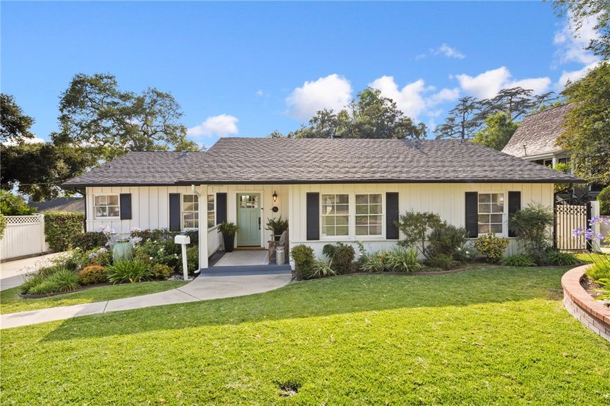 This beautifully maintained traditional ranch home is nestled in one of North Monrovia’s most desirable neighborhoods. This 3-bedroom, 2-bathroom home offers timeless curb appeal, original character, and thoughtful updates throughout. Step onto the inviting covered front porch, where a tranquil water fountain and lush professional landscaping set the tone for this special property. Inside, you'll find gleaming original hardwood floors, recessed lighting, and a spacious layout perfect for both everyday living and entertaining. The elegant living room features a cozy fireplace and flows seamlessly into a formal dining area. The kitchen has been tastefully updated with granite countertops, a chic tile backsplash, and stainless-steel appliances. A nearby three-quarter bathroom and dedicated laundry area with washer and dryer add functionality. A step-down family room is a true highlight, with a stunning wall of windows that frames the picturesque backyard and brings in an abundance of natural light. Custom built-ins add warmth and practicality to this inviting space. The home features two spacious guest bedrooms and a beautifully renovated full bathroom, complete with marble countertops, a designer tile tub and shower, and ample linen storage. The primary bedroom is privately situated at the rear of the home, offering peace and quiet. Outdoors, you’ll find a private, gated oasis complete with majestic oak trees, custom brick-lined patio, a built-in BBQ island with cooktop and countertop bar—perfect for dining and entertaining. Additional features include a tankless water heater, an updated electrical panel, a two-car detached garage, and a wide driveway with ample parking. Don't miss your opportunity to own this quintessential Monrovia gem where comfort, character, and style come together in perfect harmony.