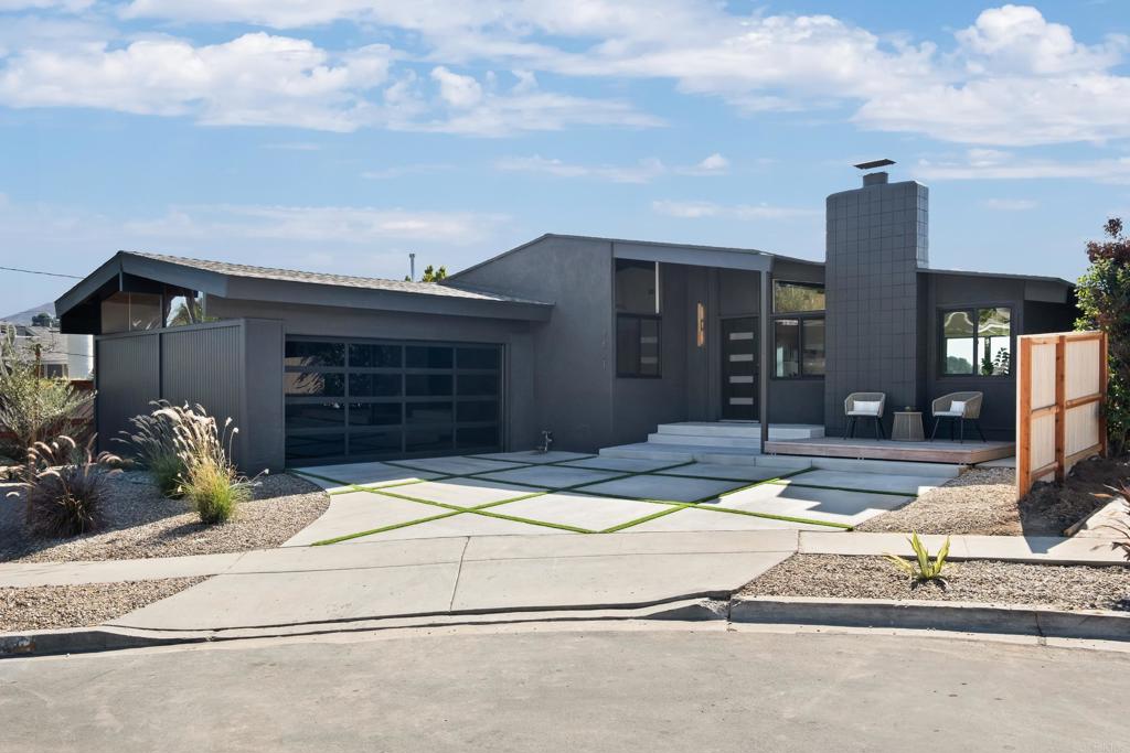 Nestled in the highly sought-after neighborhood of Bay Park, this 4-bedroom, 2-bath mid-century modern home sits at the end of a quiet cul-de-sac. Known for its central location, Bay Park offers unbeatable convenience—just minutes from Downtown San Diego, Mission Bay, top-rated schools, beaches, and scenic parks. Designed with timeless architecture and contemporary flair, this home features an open-concept layout with exposed beams, modern fixtures, and a fully remodeled kitchen with quartz countertops and sleek cabinetry. Expansive windows and a deck off the living room slider capture panoramic views of city lights and the bay, creating the perfect space for entertaining or relaxing at sunset. The primary suite provides a serene retreat, while the additional bedrooms offer flexibility for guests, a home office, or creative use. A dedicated interior laundry room, updated bathrooms, and fresh finishes throughout add comfort and functionality. Combining design, convenience, and location, this Bay Park gem embodies the best of San Diego coastal living—stylish, central, and effortlessly elevated.