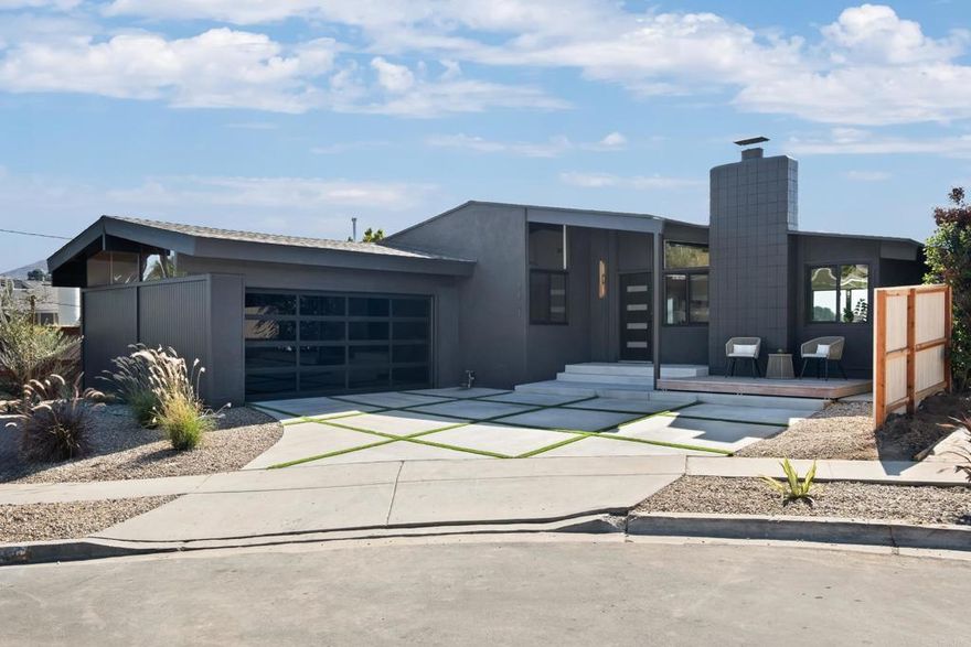 Nestled in the highly sought-after neighborhood of Bay Park, this 4-bedroom, 2-bath mid-century modern home sits at the end of a quiet cul-de-sac. Known for its central location, Bay Park offers unbeatable convenience—just minutes from Downtown San Diego, Mission Bay, top-rated schools, beaches, and scenic parks. Designed with timeless architecture and contemporary flair, this home features an open-concept layout with exposed beams, modern fixtures, and a fully remodeled kitchen with quartz countertops and sleek cabinetry. Expansive windows and a deck off the living room slider capture panoramic views of city lights and the bay, creating the perfect space for entertaining or relaxing at sunset. The primary suite provides a serene retreat, while the additional bedrooms offer flexibility for guests, a home office, or creative use. A dedicated interior laundry room, updated bathrooms, and fresh finishes throughout add comfort and functionality. Combining design, convenience, and location, this Bay Park gem embodies the best of San Diego coastal living—stylish, central, and effortlessly elevated.