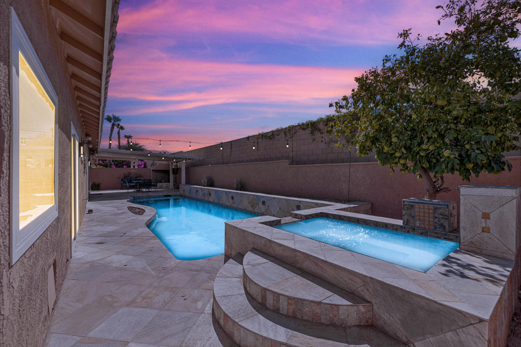 Motivated Seller! Your private desert oasis awaits! Exquisitely updated, this beautifully remodeled home in the sought-after Bella Vista neighborhood of North La Quinta offers approx. 2,600 SF of open-concept living, featuring 4 bedrooms, 3 bathrooms, and a rare private casita. Enter through designer gates into a private courtyard & enclosed patio with a cozy fire pit for intimate gatherings. Natural light pours into the expansive great room with soaring ceilings. Prepare to be impressed by the spacious newly completed stylish kitchen, thoughtfully designed for both culinary excellence and effortless entertaining. Gorgeous tiled backsplash, expansive countertops and generous cabinets, ideal for the modern cook or host. Bright breakfast nook off kitchen with French Doors that open to outdoor living with fireplace. Dining room with flexible use as a family room. Retreat to the spacious primary suite with slider and poolside views to the patio. Experience a spa-like escape in the beautifully remodeled primary bathroom, complete with a breathtaking large double shower, dual sinks, & walk-in closet. Two additional bedrooms with walk-in closets, one with glass frosted sliding doors & beautifully remodeled bathroom. A separate casita off courtyard with remodeled bathroom, walk-in closet & mini split AC unit, offers the perfect private retreat for guests. Escape to your backyard oasis with elegant travertine walkways, where you can relax in the pool & spa with soothing fountains, or host memorable gatherings around the custom fireplace & built-in BBQ. Laundry room, newer flooring throughout, recessed lighting, sola tube lighting, 2 car garage. Centrally located, in the IID for lower cost electricity. Low HOA! Close to IW Tennis Garden, dining, shopping, golf & festivals!