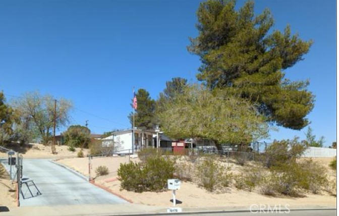 Excellent Single Story Family Home on an Lot little over One Acre- Spacious 3 Bedrooms - 2 Remodeled Bathrooms and Country Kitchen- Formal Living Room with Amazing Panoramic Desert Sunset View from the Living Room- Fireplace - Good Size Enclose Sun Room- Brand New Solar Power Panels and Tesla Powerwall and Electrical Panels- Sparkling Divers Pool and Spa - Large Storage Shed -Oversized Covered Multi Car Carport and Plenty of Additional off Street Parking, Huge Side area Large enough for a Dog Run -Ideal for Entertaining - Plus a 2 Car- Attached Garage- Yacca Trees -Beautiful and Peaceful Location- Auto Electric Security Gate -Concrete Driveway. Close to Shopping and Freeway.