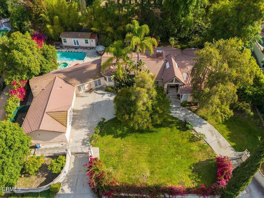 This cherished family home in prime Tarzana is located south of Ventura Blvd offering room to grow, remodel, and make your own. Set on an impressive 21,392 sq ft flat lot, this 5-bedroom, 6-bathroom single-story home spans approximately 4,233 sq ft and has been cared for by the same family for over 25 years. The open, flowing layout provides flexibility for everyday living, entertaining, and future redesign. Generously sized living areas are ideal for hosting large gatherings while a cozy Music & Movie Family Room has served as a treasured gathering space for years adding to the home's unique charm and natural sense of comfort. A detached structure on the property, used for many years as a Music Studio, presents great potential--whether as a creative workspace, guest space, pool house, or rental. Outdoors, enjoy the pool & spa with plenty of space for future vision & expansion. This is a well-loved home with solid fundamentals, ready for the next owner to reimagine and personalize. Located near top schools, shopping, dining &  recreation the home offers a rare blend of space, potential, and location.