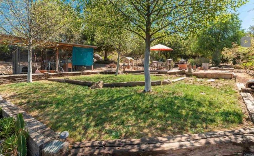 Fixer on 1.19 acres. The property features a main house and a newer built modern ADU, constructed with sleek metal finishes. The garden needs TLC but it could be a monarch butterfly paradise with mature vegetation, open sunny spaces, and ample room for pets & children. A gated driveway entry ensures privacy.