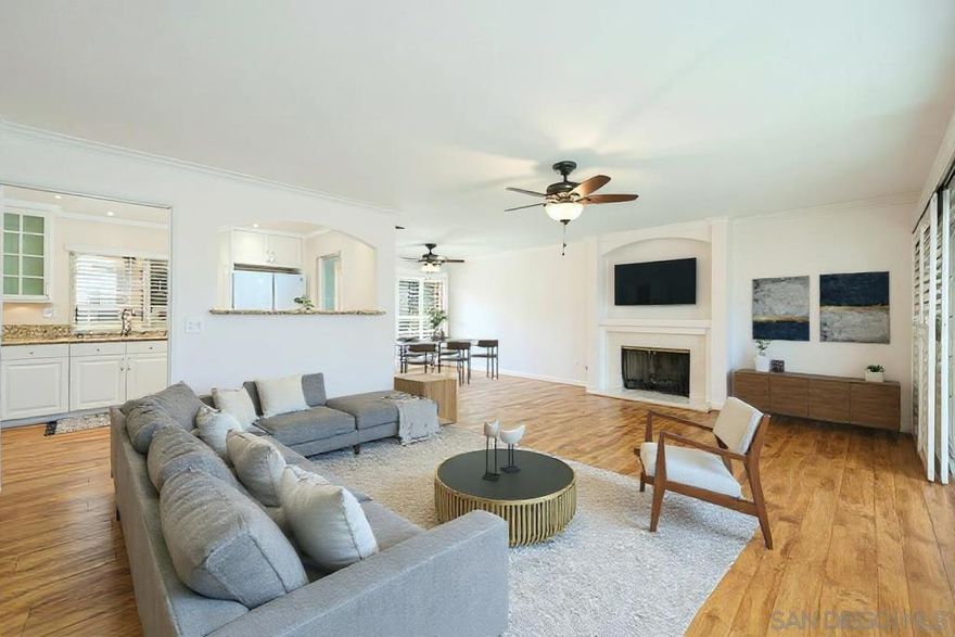 Luxury 55+ single level downstairs end unit in a prime location with no steps! This versatile floor plan has 2 full bedrooms and an optional 3rd bedroom/office/den, keyless entry and security screen for added peace of mind, crown molding, wood shutters & laminate flooring throughout, new LED lights, and new handles on interior doors. The great room features a gas fireplace & front and back private patio access with partial views overlooking Oaks North. Remodeled kitchen with granite counters, white cabinets & soft...  close drawers. Updated bathrooms with tiled showers, granite counters and soft-close drawers. Updated HVAC system with cleaned ducts, new water pressure regulator, updated electrical outlets Oversized detached 1-car garage with shelving, a workbench and keyless entry. Oaks North is a phenomenal 55+ community offering many amenities, including pool, spa, tennis courts, social activities, and more.