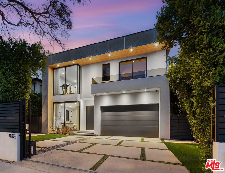 State-of-the-art TECH-HOME built and designed to perfection! With over 5400 square feet of interior living, this private compound showcases a breathtaking blend of imported European stone with a masterfully designed custom-curated finish. The 1300-square-foot luxurious Master retreat redefines opulence with its showroom walk-in closet, private lounge and a luxurious spa-like master bathroom. The exceptional chef kitchen is dressed with phantom black Italian stone countertops, one-touch hydraulic cabinetry, Miele appliances, and for the enthusiast - a wine gallery. The open floor-plan concept is complimented with its walls of sliding glass pocket doors, rooftop terrace boasting incredible views, pool/spa, movie theater, and a state-of-the-art TECH-HOME technology that allows for security, lighting, and entertainment to be controlled at your fingertips from anywhere in the world. Extremely desirable Beverly Grove location within minutes to The Grove, Cedars Sinai, Beverly Hills and Downtown L.A!
