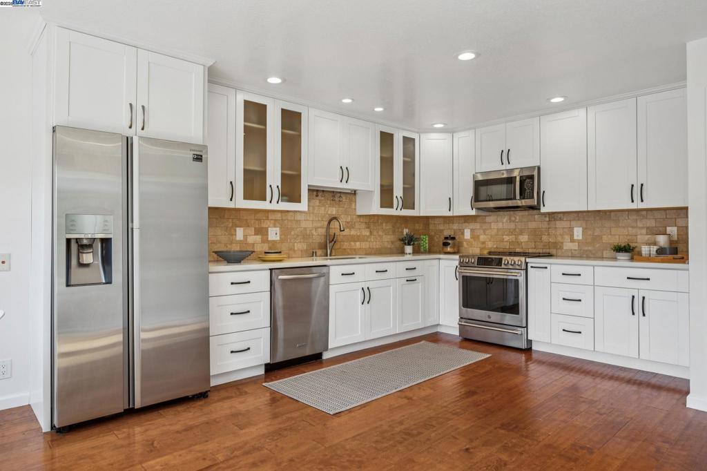 Spacious 4 Bedroom townhome in the Islandia Community in a serene greenbelt setting. Open kitchen with plenty of cabinets and stainless appliances hardwood floorings. The spacious living room and dining area overlooks lush greenery. Main level includes a half bath and laundry room. Second level features a spacious primary suite with vaulted ceilings, walk-in closet and en-suite bath. The additional three bedrooms are also spacious and share a full bathroom. Sunny backyard area and a 2 -Car Garage. Home also features AC. The Islandia community offers resort-style amenities including a community pool, tennis courts, a large clubhouse perfect for hosting events, and a greenbelt that brings space and serenity to your everyday routine. Convenient Bay Trail for jogging or sunset stroll. With top-rated schools, local eateries, shopping, and easy access to the SF Ferry, Transbay buses, BART, & Oakland International Airport.