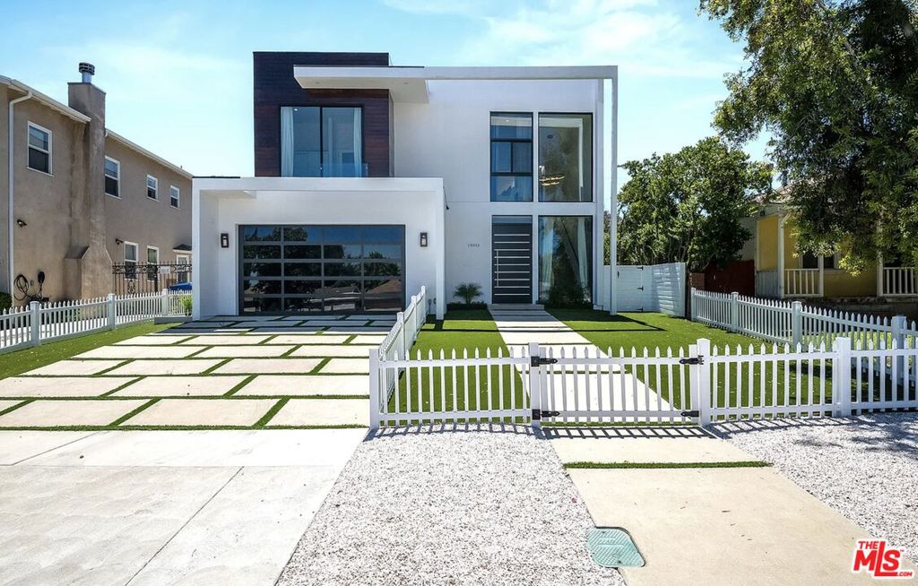 MASSIVE PRICE REDUCTION! PRICED TO SELL! Was $2,799,000 now offered at a compelling new price $2,625,000. 18016 Valley Vista Blvd presents exceptional value in one of Encino's most sought-after neighborhoods. This 2022-built modern residence combines elegant design with comfort and functionality.With 5 spacious bedrooms and 5.5 bathrooms, the home features a bright, open-concept layout perfect for both everyday living and entertaining. The expansive primary suite includes a spa-like bathroom and a rare dual-entry walk-in closet. Each additional bedroom has its own en-suite bathroom, and the downstairs bedroom is currently set up as a home office ideal for today's flexible lifestyle. Can be offered fully furnished for additional price, the home includes a king bed in the master, queen beds in two guest rooms, and a twin in the children's room making it truly move-in ready. The sleek, modern interiors are finished with high-end materials, designer fixtures, and abundant natural light. A dedicated laundry area with hookups adds convenience. Step outside to enjoy a private backyard retreat with a sparkling pool and spa perfect for relaxing or entertaining.Located near top-rated schools and just minutes from Ventura Blvd's shops and restaurants, this is an outstanding opportunity to own a luxury home at an unbeatable price.