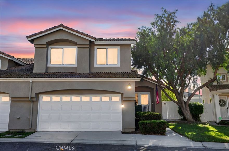 Step into this bright and well-designed townhouse in the desirable Corona Hills area. Vaulted ceilings greet you on the main floor, where the living room with a cozy gas fireplace and half bath opens onto a covered patio and small yard with no rear neighbors—ideal for outdoor lounging or casual dining.  The updated kitchen features full-sized, stainless steel appliances, and flows into the dining nook for seamless entertaining.  Upstairs you’ll find three bedrooms and two full bathrooms—one of which is the primary suite with dual sinks and step-in shower.  A direct-access two-car garage gives you parking and storage convenience.  The association pool and spa are just steps away, giving you resort-style relaxation right in your community.  Location is a win: close to shopping, dining and major freeways (91 / 15) for easy commutes and convenience.