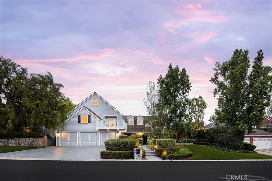 Located in sought-after Nellie Gail Ranch, this customized estate offers luxury indoor-outdoor living and serene privacy on a 0.71-acre, equestrian-zoned lot. The spacious 3884 sq ft main house features a desirable 5-bedroom layout including a main floor bedroom. Arrive through the elegant entry to herringbone white-oak hardwood floors that flow throughout. Natural light fills the interior through Monumental laminated windows and doors, complemented by solar shades to the rear. Home chefs will love the gourmet kitchen with high-end appliances, including double dishwashers and SubZero refrigerator, plus ample storage, center island and built-in water purifier. The family room hosts a gas fireplace and full bar with wine fridge, opening effortlessly through French doors onto the outdoor entertaining deck. Settle into a quaint library nook with built-in shelves, and enjoy dedicated workspace in a bonus office loft upstairs. The primary suite has a chic en suite bath with cast-iron tub and onyx finishes. Each bedroom features custom California Closets, with three additional bedrooms upstairs and an enhanced secondary bath with double sinks and beadboard detail. Equipped for comfort and efficiency, the home features streamlined HVAC split systems, 400-Amp electrical service, upgraded siding and roofing, smart home technology and ADT security. Move outside into your private oasis, where mature California pepper and fruit trees frame a carefully landscaped property with a picturesque dry riverbed aesthetic and fragrant lavender. Entertain in the outdoor living room, complete with a FireMagic grill, warming drawer, clear ice maker, TV, heaters, surround sound and fans. A dining gazebo easily accommodates large gatherings, and durable Trex-style decking means easy maintenance. The separate 600 sq ft guest house doubles as a pool retreat, offering a Murphy bed, kitchenette, retractable awning, LaCantina folding doors, powder bath and its own A/C. The raised pool has swim jet resistance for exercise, while the lower level jacuzzi calms with a tranquil waterfall. Wine enthusiasts will enjoy the insulated wine cellar housing two Viking coolers and storage. Enjoy convenient access to freeways, top schooling, shopping, and world-class beaches, all in one of the region’s premier neighborhoods.