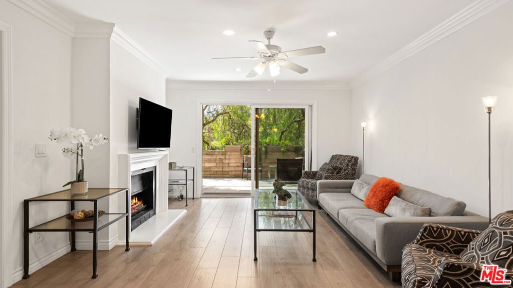 Nestled in the heart of Malibu, this beautifully remodeled 2-bedroom, 2-bathroom condo offers a perfect blend of modern elegance and coastal charm. The open floor plan is accentuated by new wooden floors and recessed lighting, creating a bright and inviting atmosphere. The custom kitchen boasts white cabinets, white stone countertops, a textured backsplash, and stainless steel appliances, making it a chef's delight. Both bedrooms are spacious, featuring new ceiling fans and ample natural light. The bathrooms have been thoughtfully updated with neutral ceramic tiles, granite vanity tops, and high-end cherry cabinets. Enjoy the serene outdoor patio accessible from both the living room and master bedroom, perfect for relaxation or entertaining. Additional amenities include in-unit laundry, an oversized 2-car detached garage, and access to community facilities such as a pool, spa, clubhouse, and basketball area. Ideally located minutes from Zuma Beach and Malibu Mart, this condo offers the best of coastal living.